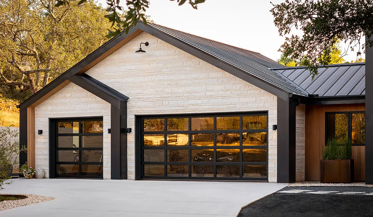 Clopay Avante aluminum and glass garage door on contemporary home