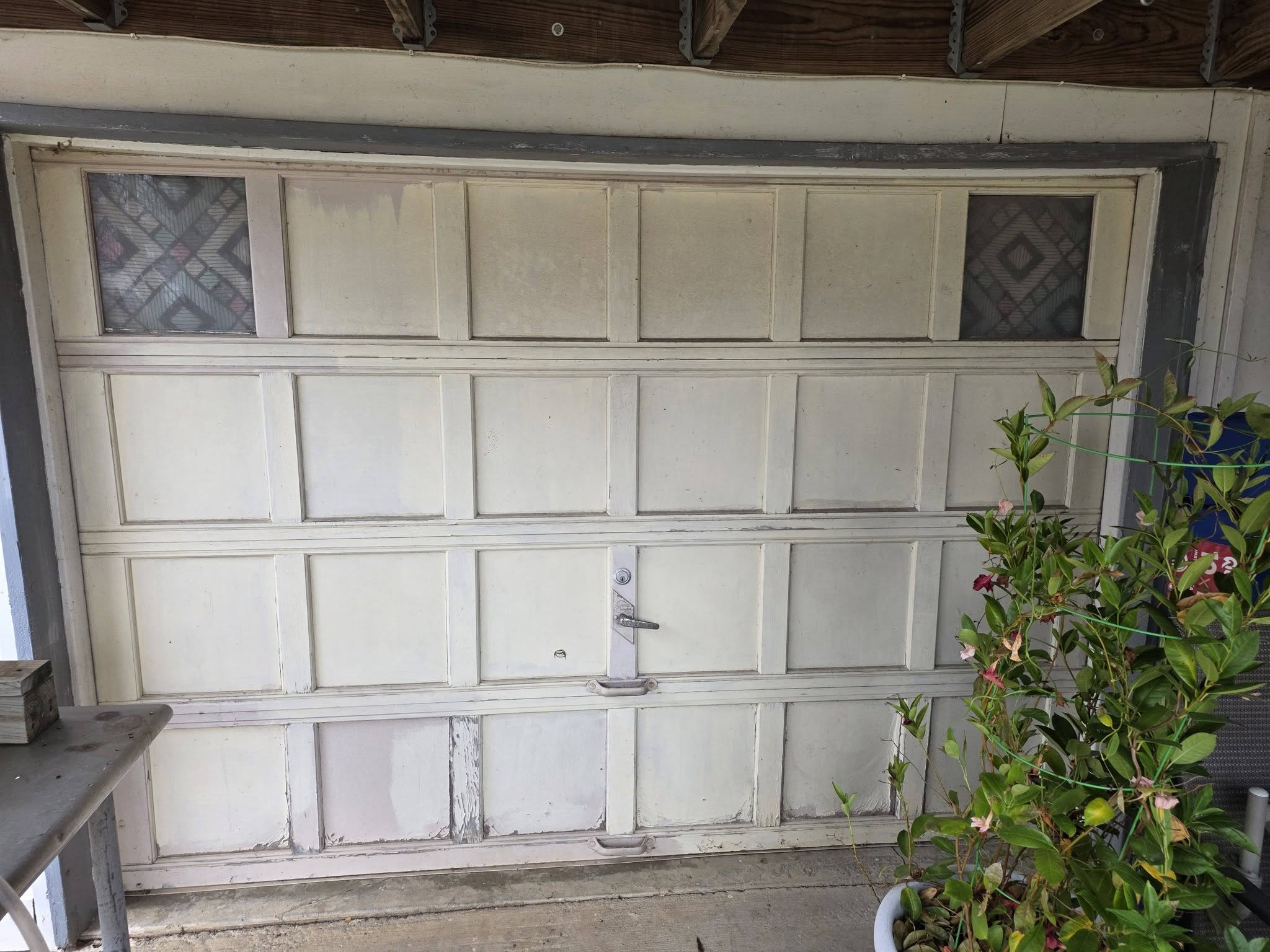 Old peeling garage door before removal