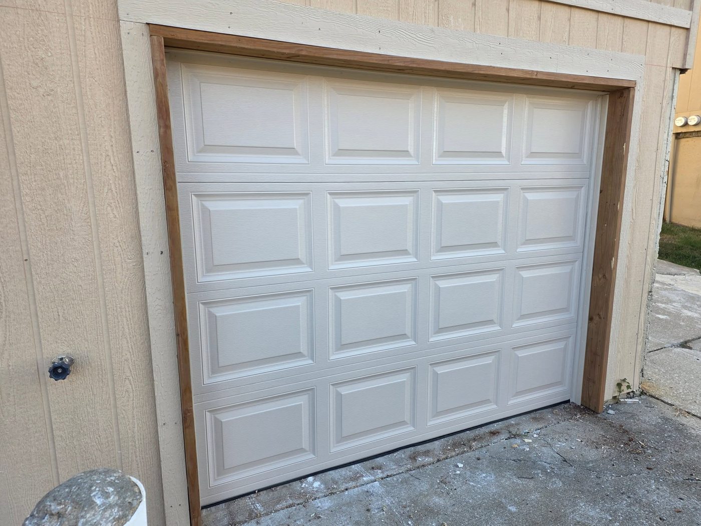 New white garage door on a new-construction garage